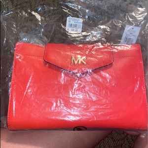 Mandarin Michael Kors crossbody purse.